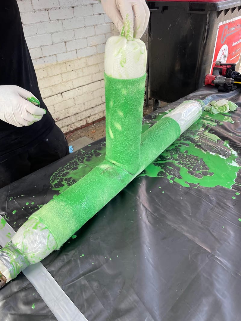 Resin-saturated liner ready to be pulled through a Y-junction pipe section